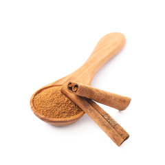 Wooden spoon full of cinnamon