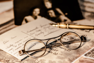 Old letter, eyeglasses and photo.