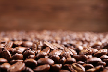 Coffee beans on brown background