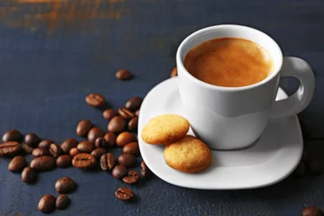 Fotobehang Cup of coffee on wooden table background © Africa Studio