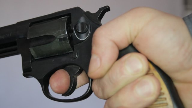 Revolver in hand, detailed closeup