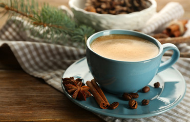 Cup of coffee and Christmas tree branch on napkin