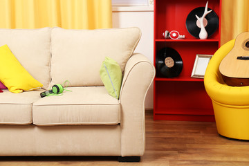 Living room interior with sofa and coloured pillows