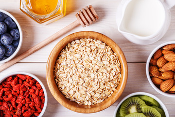 Healthy breakfast - bowl of oat flakes with fresh fruit, almond