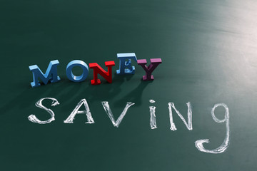 Money saving concept on a blackboard background