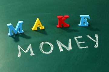 Make money concept on a blackboard background