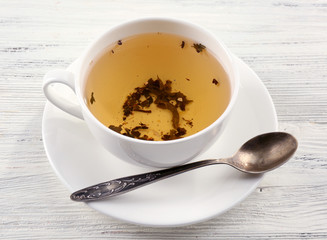 Cup of tea on white table, closeup