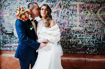 Lovely wedding couple background graffiti wall of love words