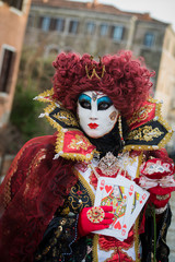 Fototapeta na wymiar Venice - February 6, 2016: Colourful carnival mask through the streets of Venice and in St. Mark's Square during celebration of the most famous carnival in the world.