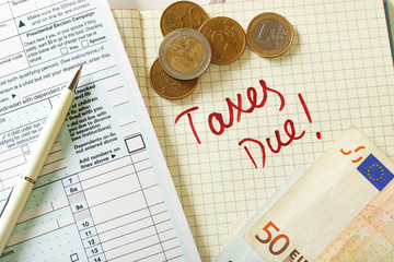 Taxes due written in the planner, close up