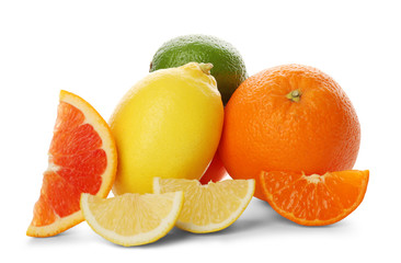 Mixed citrus fruit including lemon, lime, orange, tangerine and slices isolated on a white background, close up