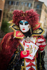 Fototapeta na wymiar Venice - February 6, 2016: Colourful carnival mask through the streets of Venice and in St. Mark's Square during celebration of the most famous carnival in the world.