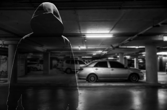 Car thief at parking lot ( criminal concept )