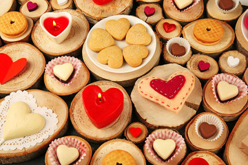 Valentine's Day concept. Different  hearts on wooden stumps background