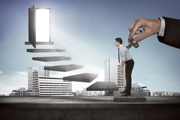 Hand turns clockwork on the back of business person