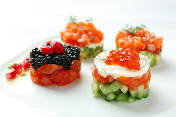 Delicious salmon tartare on white plate
