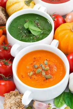 assortment of vegetable cream soups and ingredients, top view