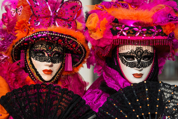 Venice - February 6, 2016: Colourful carnival mask through the streets of  Venice and in St. Mark's...