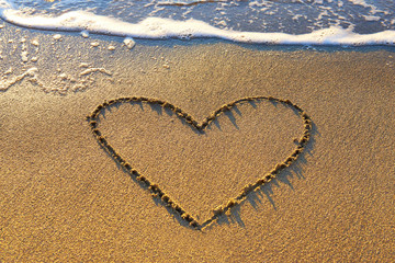 Fototapeta na wymiar Heart on the sand