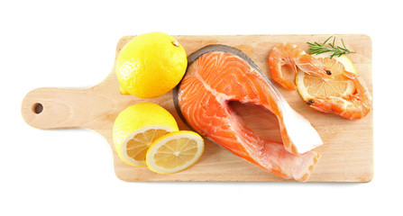 A set of salmon steak an a lemon, top view
