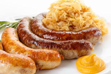 Traditional Oktoberfest menu, plate of sausages and sauerkraut