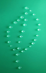 Leaf made of water drops on green background