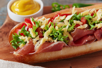 sandwich baguette ham jamon cheese with tomato and herbs
