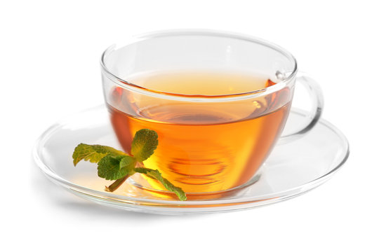 Cup of tea and mint isolated on white