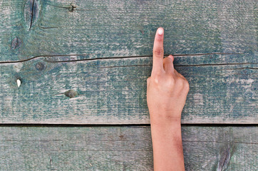 hand, numbers and wood