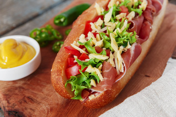sandwich baguette ham jamon cheese with tomato and herbs