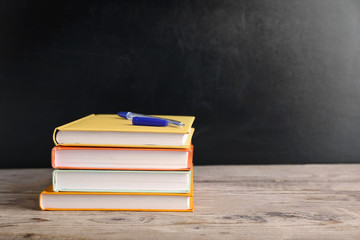 Few books with pen on table