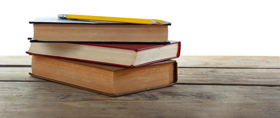 Few books and pencil on table