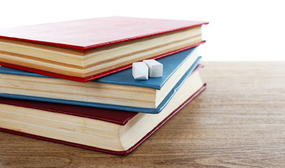Few books with chalk on table