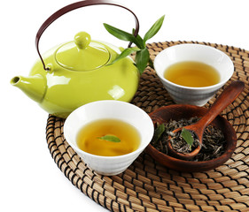 Green tea with utensils, isolated on white