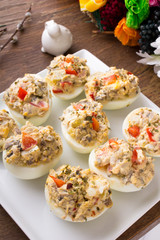 stuffed eggs with peppers, mushrooms and herbs - selective focus