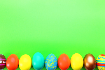 Easter eggs on green background