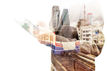 Double Exposure of Business Man use Tablet and Skytrain or Subwa