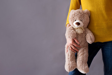 Young girl, holding sweet fluffy teddy bear