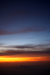 Fototapeta na wymiar Beautiful sunset above the clouds