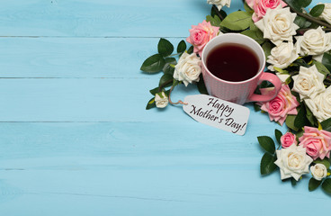 Cup of tea with roses and mothers day tag