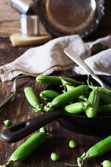 Pods of fresh green peas