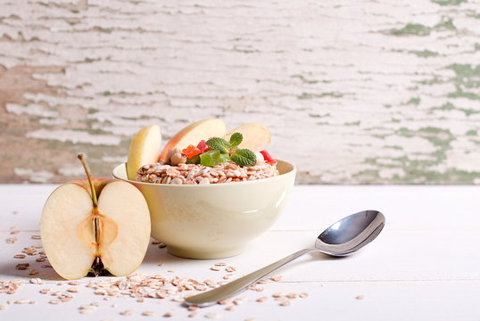Muesli with apple on the table