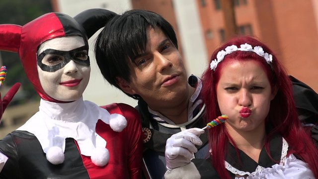 Happy Cosplay Friends With Lollipops