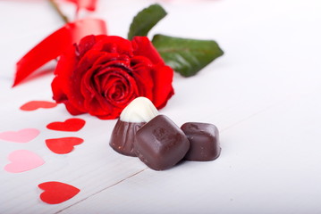 Chocolate candies and rose