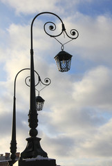 Ancient metal lantern on blue sky