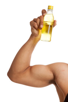 Muscular Asian Man's Arm  Flexing Biceps With Electrolyte Drink