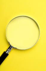 Magnifying glass on background