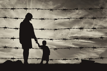  Silhouette of hungry refugees mother and child