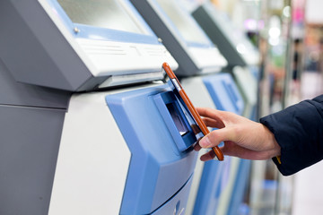 Woman pay with cellphone by NFC on ticketing system