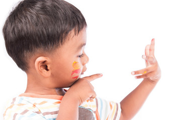 little boy play painting on face